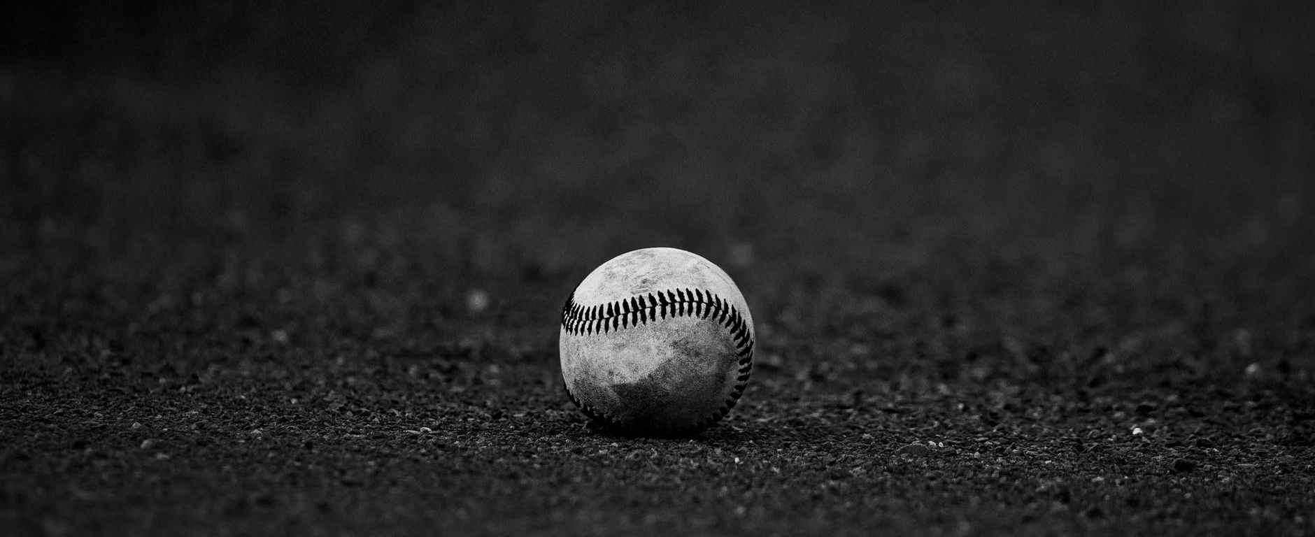 selective focus grayscale photography of baseball